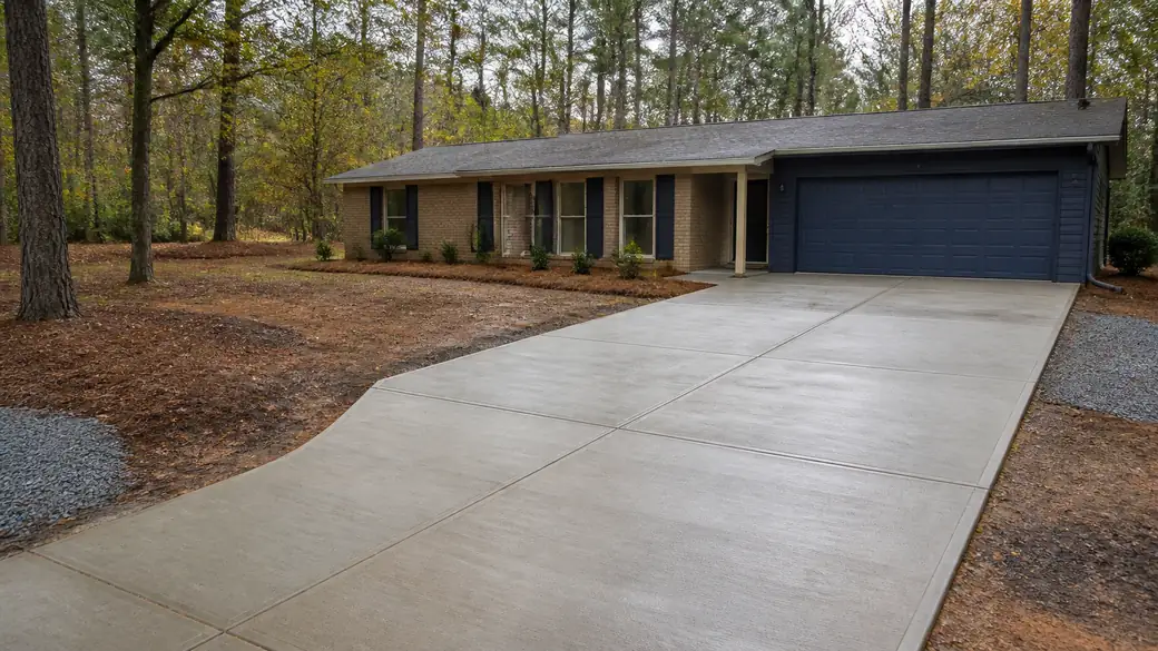 cement installation completed by a local contractor at a buff-brick ranch home in Warner Robins, GA, after a rain shower.
